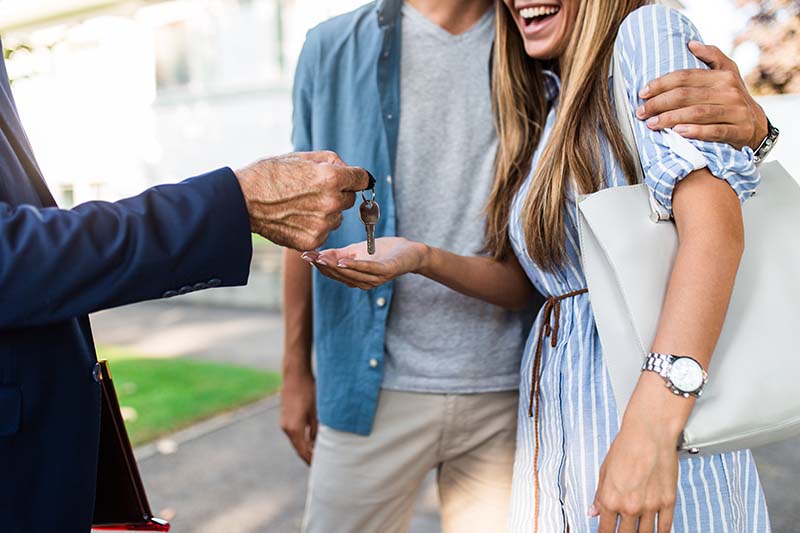 Couple getting the keys to their new home