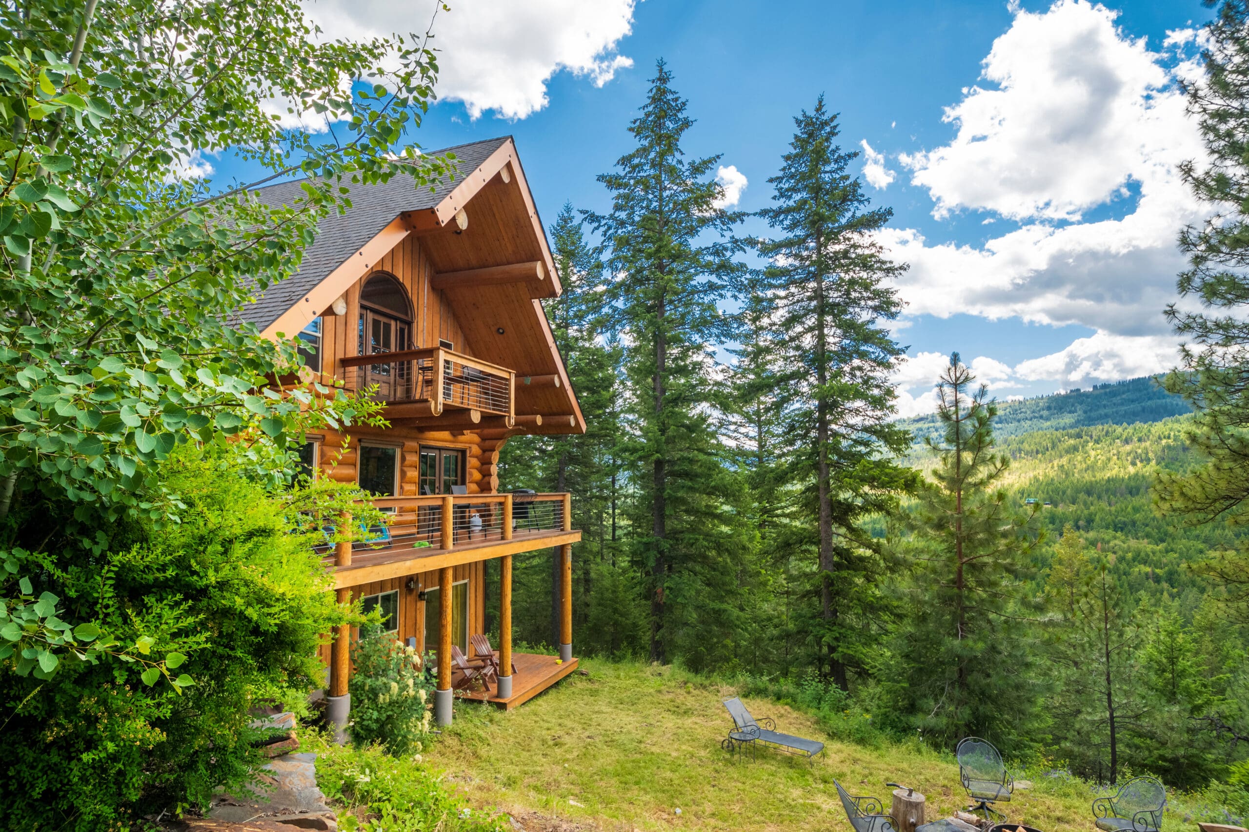 A 3 story log home with decks in the mountains near Coeur d'Alene, Idaho, USA A 3 story log home with decks in the mountains.